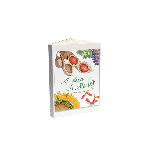 En bok med bilde av nøtter, frø, solsikker og blader