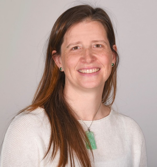 Portrait of Rosalynn Austin wearing a white sweater
