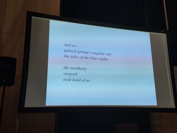 Image of a conference slide showing an excerpt from a poem by Sámi poet Nils-Aslak Valkeapää:

and we
gained spring's singular sun
the tales of the blue nights

the northerly
swayed
tool hold of us